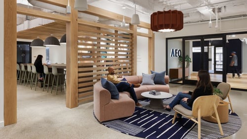 American Eagle Outfitters NYC Headquarters Lobby with lounge furniture and a bar with an island in the background